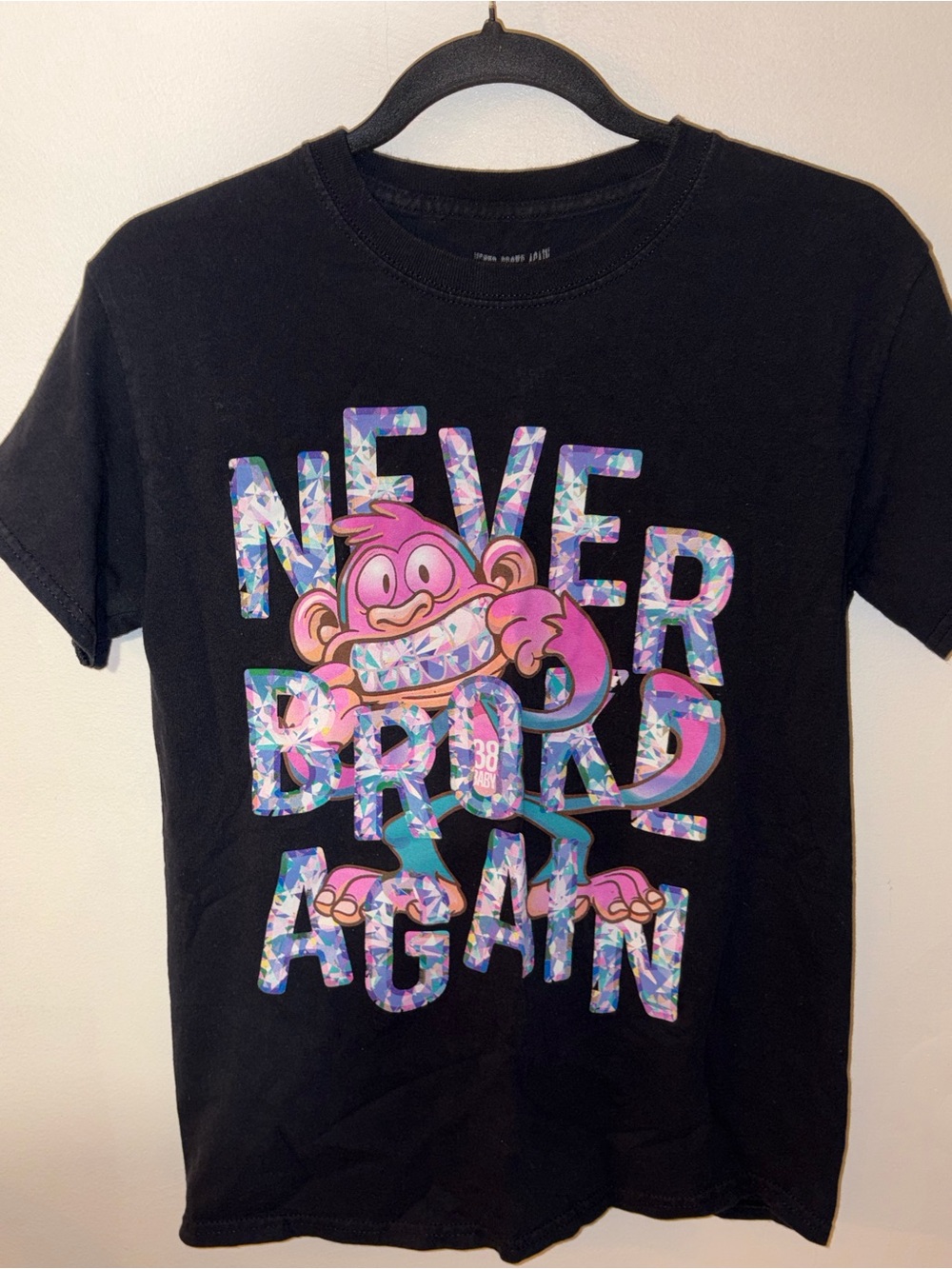 Never broke again Black Tee with Pink Monkey and Colorful Mosaic Text
